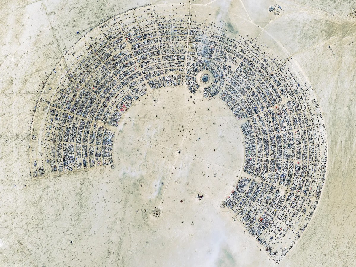 Aerial view of Black Rock City — the circular street grid of Burning Man laid out on the desert playa.