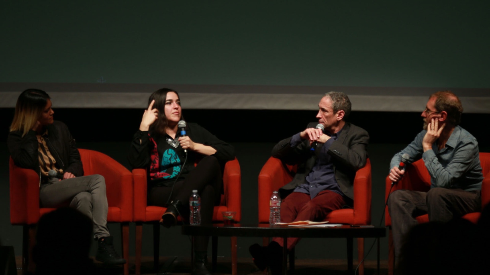 Josette Melchor on stage in conversation with Douglas Rushkoff and Erik Davis for Team Human.